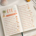 Une main féminine écrit dans un Bullet Journal avec des stickers d'été.