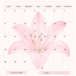 Planificateur mensuel décoré de lys roses sur une table